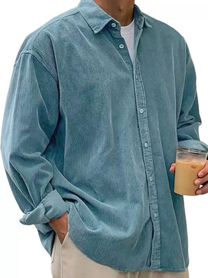 Men's blue corduroy button-up shirt with a classic fit and long sleeves.