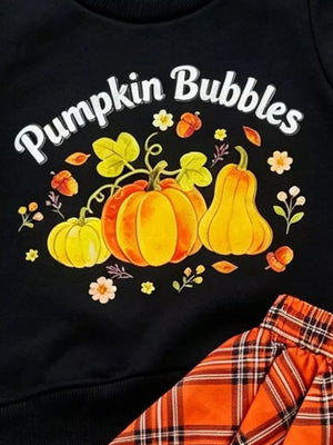 Black baby set with pumpkin print and orange plaid skirt.