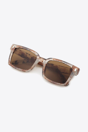 Marble effect rectangular sunglasses with brown lenses and a clear, brown marbled frame.