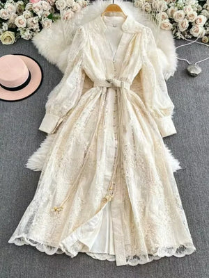 Lace maxi dress with tie waist, balloon sleeves, and button-down front in apricot.