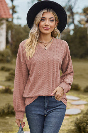 Textured cable knit V-neck pullover sweater in Dusty Pink with long sleeves.