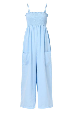 Light blue smocked bodice palazzo jumpsuit with wide legs and pockets.