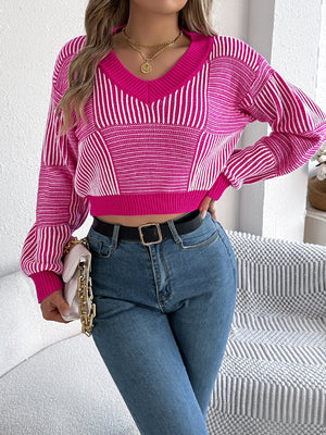 Hot pink and white geometric stripe cropped v-neck knit sweater with balloon sleeves.