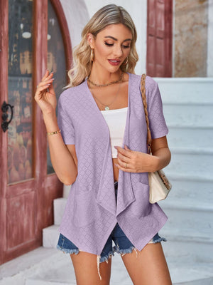 Lavender perforated shawl collar jacket with short sleeves and pockets.