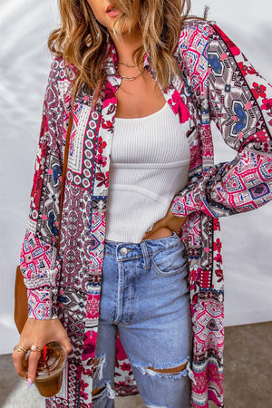 Patchwork print duster shirt jacket with button front and long sleeves, styled with a white tank and ripped jeans.