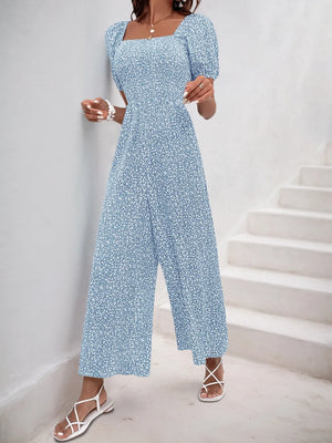 Light Blue floral smocked bodice jumpsuit with puff sleeves and wide legs.