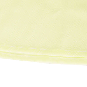 Light yellow airy cami and maxi skirt set fabric detail with subtle texture and double stitching.