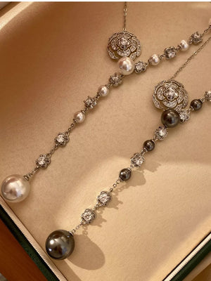 Y-necklace with pearl and crystal flower charms in white and gray options