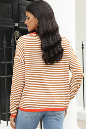 Nautical knit crewneck sweater with horizontal stripes and contrast trim.