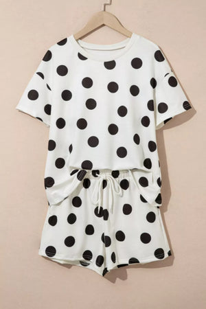 White polka dot loungewear set with crew neck top and drawstring shorts.