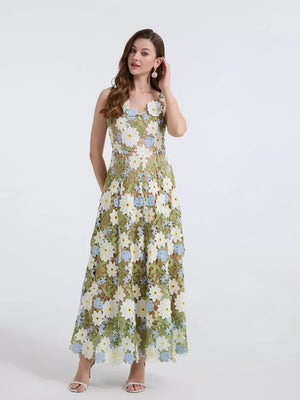 Embroidered floral maxi dress in green with appliqué details and a square neckline.