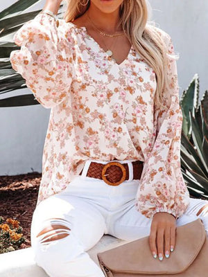 Floral print v-neck long sleeve maternity shirt with bishop sleeves.