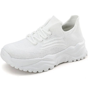 White textured knit sneakers with a chunky sole and lace-up closure.