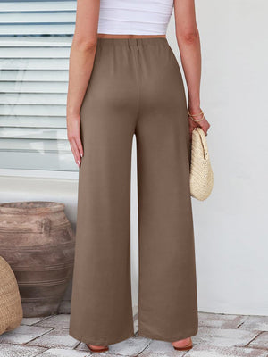 Pleated palazzo trousers in taupe with pockets and a wide leg.