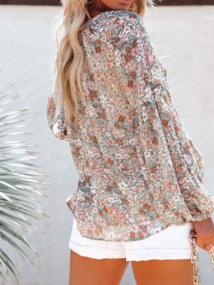 Maternity floral print long sleeve shirt in green with V-neck, shown from the back.
