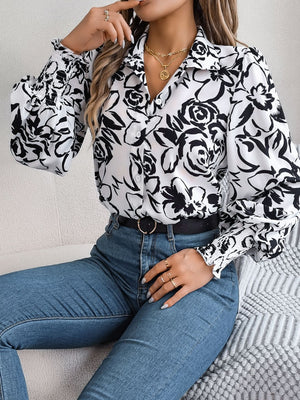 White floral print blouse with button front and shirred cuffs