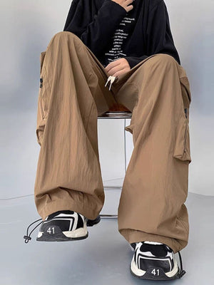 Men's camel cargo sweatpants with drawstring and zip pockets, relaxed fit.
