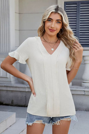 Cream textured blouse with V-neck, pleat front, and flutter sleeves.