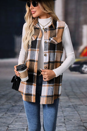Plaid utility vest in camel with button front and patch pockets, worn over a white turtleneck.