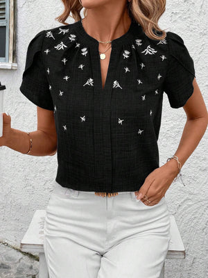 Black embroidered floral keyhole blouse with short sleeves and a split neckline.