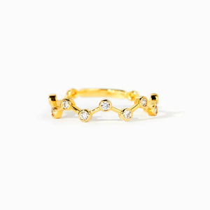 Gold celestial ring with clear zirconia stones in a wave pattern