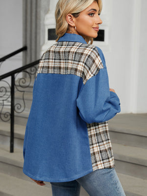 Denim overshirt in dusty blue with plaid patchwork on the back and sleeves, buttoned front.