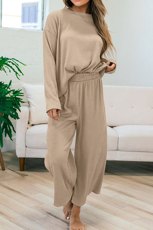 Khaki textured knit loungewear set with crew neck top and wide leg pants.