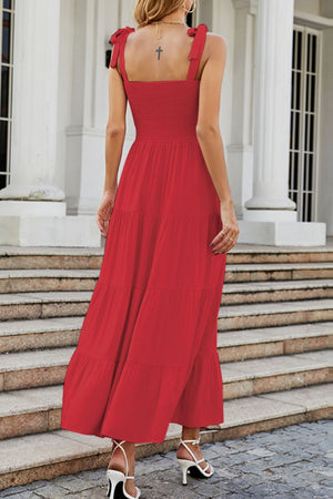 Red tiered ruffle smocked bodice maxi dress with tie straps.