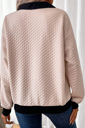 Diamond quilted polo sweatshirt in tan with black collar and cuffs.