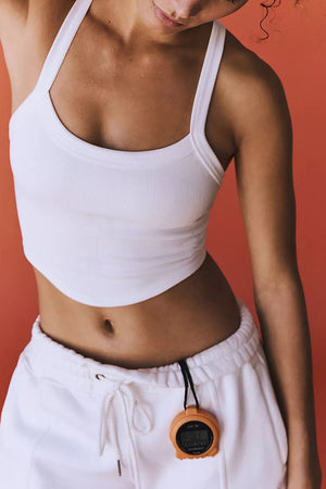 White ribbed active tank top with curved hem and scoop neckline