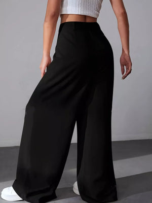 Black high-waisted pleated wide-leg maternity trousers with a button detail.
