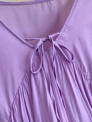 Purple bohemian maxi dress with tie-neck detail and gathered skirt