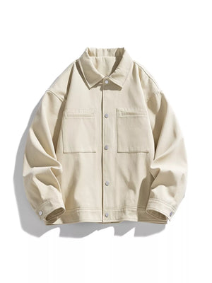 Oversized casual snap jacket in apricot cotton with two chest pockets and snap closures.
