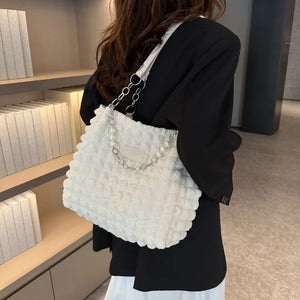 Textured grid pearl chain tote bag in ivory with a ruched fabric design.