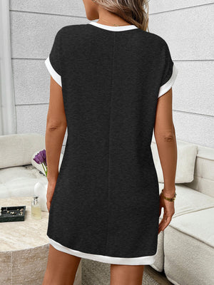 Ribbed knit mini dress in dark blue with white trim, short sleeves, and crew neck.