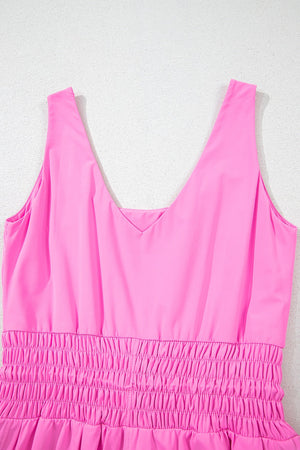 Scoop neck active romper set in fuchsia pink with smocked waist detail.