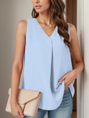 Sleeveless light blue blouse with V-neck and front pleats.