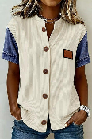 Ribbed knit shirt with denim sleeves, button front, and patch detail.