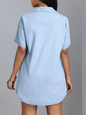 Light blue denim shirt dress with short sleeves and collared neckline.