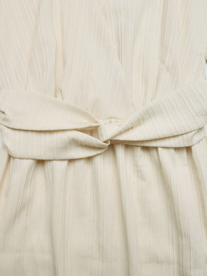 Beige cotton blend midi dress with a twisted knot detail at the waist.