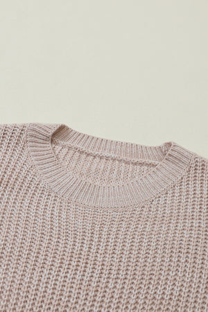 Tan textured knit sweater with crew neck and ribbed details