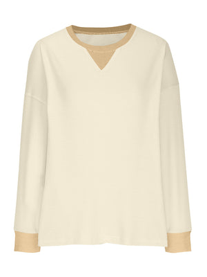 Cream waffle knit raglan sleeve sweatshirt with tan neckline and cuffs.