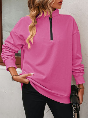 Hot Pink quarter-zip relaxed fit sweatshirt with a mock neck and black zipper.