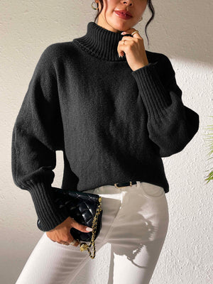 Black balloon sleeve turtleneck sweater with ribbed cuffs and collar.