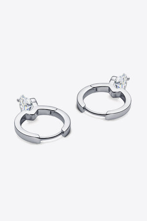 Silver huggie hoop earrings with a single marquise-cut gemstone accent.