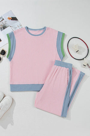 Ribbed blush pink loungewear set with blue and green trim. Sleeveless top and pants.