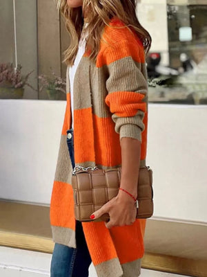 Color block knit cardigan with orange and beige stripes, open front, long sleeves.