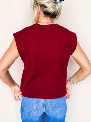 Burgundy crew neck cap sleeve sweater with a casual fit.