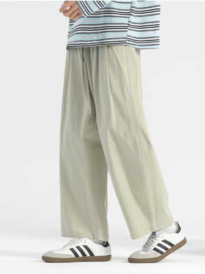 Men's sage wide-leg drawstring casual trousers with a relaxed fit.