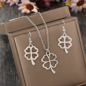 Silver four-leaf clover pendant and earring set made of alloy.